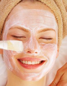 Portrait of a young girl enjoying a healthy skin treatment at a spa resort.